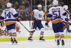 Grabbing the spotlight: Michael Grabner celebrates one of his two goals in the Islanders 4-3 shootout win over the Devils. AP Photo/Julio Cortez