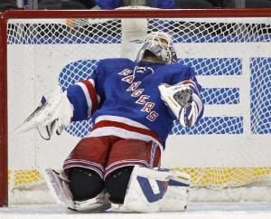 Henrik Lundqvist can't bare to look after Tyler Toffoli's shot squeezes through.  AP Photo/Kathy Willens