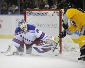 Henrik Lundqvist stifles Cody Hodgson en route to 27 saves in the Rangers' 3-1 win over the Sabres. AP Photo/Gary Wiepert