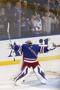 Happy Hank: Henrik Lundqvist finally can celebrate after stopping Mikael Backlund in the shootout. Getty Images/Jason DeCrow