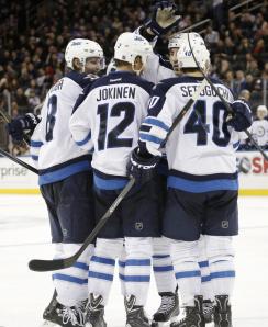 Olli Jokinen celebrates a goal in the third period with teammates. AP Photo/Kathy Willens