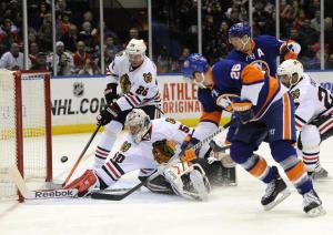 Thomas Vanek steers in a rebound as snubbed American linemate Kyle Okposo looks on. Getty Images/Kathy Kmonicek