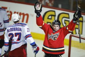 Calgary's Joe Colborne celebrates a goal while Ryan McDonagh can't bare to look.  The Canadian Press/Jeff McIntosh
