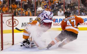 Car Bombed: Daniel Carcillo watches his redirection slip past Ray Emery for the knockout blow highlighting a Rangers 4-1 Game 3 win over the Flyers. AP Photo/Chris Szagola