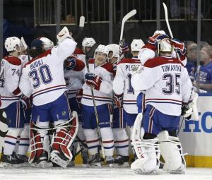 The Canadiens celebrate a 3-2 overtime win over the Rangers in Game 3 courtesy of hero Alex Galcheynuk. AP Photo/Kathy Willens 