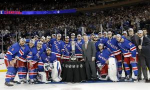 Eastern Conference Champions: An excited group of Rangers pose with the Prince of Wales Trophy after defeating the Canadiens to reach the Stanley Cup Finals. AP Photo/Kathy Willens