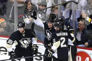 Jokinen Gets Last Laugh: Pens forward Jussi Jokinen celebrates a power play goal with teammates which made it 2-0. Pittsburgh took Game 2 over the listless Blueshirts 3-0 to even the series. AP Photo/Gene J. Puskar
