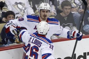 Chris Kreider is congratulated by Martin St. Louis following his goal that made it 3-1 with 1:01 left in the second period. The Rangers took Game 1 7-2 over the Canadiens. AP Photo/Gene J. Puskar