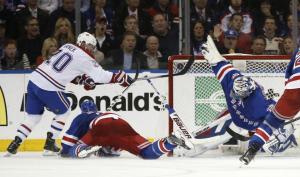 Hen-rik: Henrik Lundqvist makes an incredible save to rob Thomas Vanek. AP Photo/Kathy Willens
