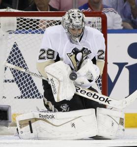 Pens netminder Marc-Andre Fleury makes one of his 35 saves en route to a second consecutive shutout. AP Photo/Kathy Willens