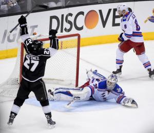 Stanley Cup hero Alec Martinez celebrates the clinching goal in double overtime. The Kings took the series in five games with three needing sudden death including last night's Stanley Cup classic. AP Photo/Mark J. Terrill