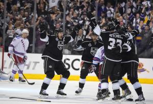 Dustin Brown celebrates his double overtime winner giving the Kings a 2-0 series lead.  AP Photo/Mark J. Terrill