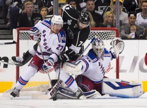 Dwight King makes contact with Henrik Lundqvist while scoring a controversial goal in Game 2. AP Photo/Mark J. Terrill