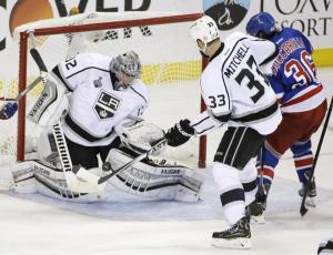 Jonathan Quick makes a save on Mats Zuccarello during his 32-save Game 3 shutout of the Rangers. AP Photo/Frank Franklin II