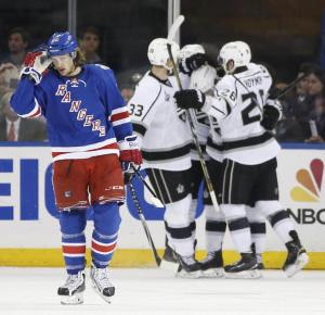 Carl Hagelin can't look as the Kings celebrate a goal. AP Photo/Kathy Willens