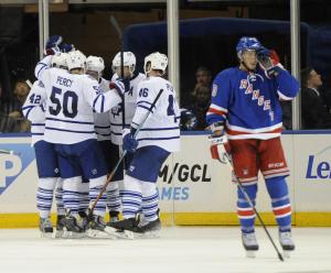 Leafs Invasion: The Leafs celebrate Tyler Bozak's goal as J.T. Miller can't look. AP Photo Courtesy Getty Images by Kathy Kmonicek