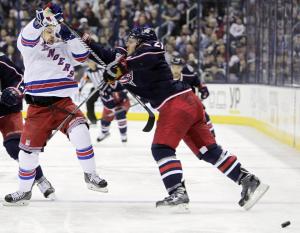 Mats Zuccarello battles James Wisniewski during Rangers' 5-2 loss to Jackets. AP Photo/Jay LaPrete Getty Images