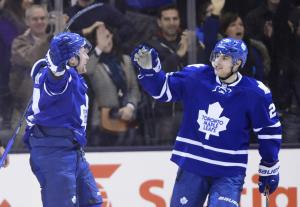 Leaf Hero: Leo Komarov celebrates his game-winner with teammate Mike Santorelli. The Canadian Press/Photo by Mike Gunn