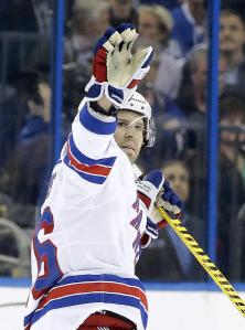 Thanks Lightning: Former Lightning captain Martin St. Louis acknowledges the crowd after a video tribute in his return. AP Photo by Chris O'Meara/Getty Images