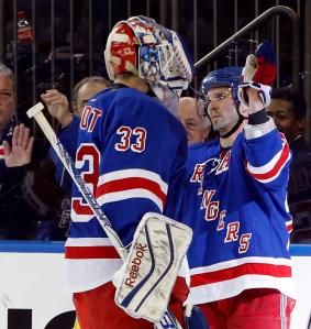 Winning netminder Cam Talbot is congratulated by goalscorer Martin St. Louis following the Rangers' 4-3 shootout win over the Blue Jackets. AP Photo by Kathy Willens/Getty Images