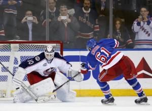 MVP candidate Rick Nash beats Curtis McElhinney in Round 3 of the shootout giving the Rangers the win. AP Photo by Kathy Willens/Getty Images