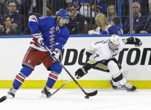 Derick Brassard battles Paul Martin during Game 2 last night. AP Photo by Frank Franklin II/Getty Images