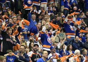 Islander fans celebrate a goal by waving their playoff towels during Game 6. AP Photo by Kathy Kmonicek/Getty Images
