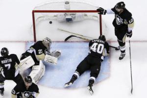 Marc-Andre Fleury can only watch along with fallen teammates as Kevin Hayes scores the OT winner. AP Photo by Gene J. Puskar/Getty Images