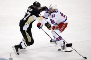 Keith Yandle battles Sidney Crosby during Game 2. AP Photo by Gene J. Puskar/Getty Images