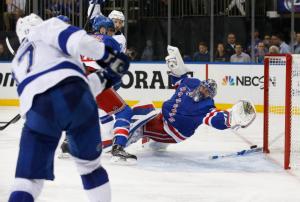 Killorn Kills It: Alex Killorn buries a shot past an outstretched Henrik Lundqvist for a key insurance marker. AP Photo by Kathy Willens/Getty Images 