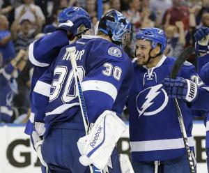 Ben Bishop is congratulated by teammate J.T. Brown following the Lightning's elimination of the Canadiens. They'll play the winner of the Caps and Rangers. AP Photo by Chris O'Meara/Getty Images