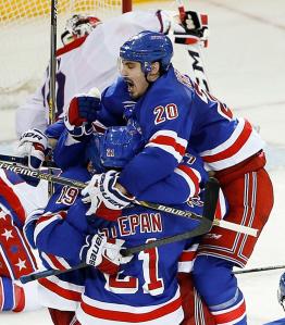 Chris Kreider jumps into the arms of Derek Stepan and teammates after scoring a clutch tying goal with 1:41 left in Game 5. The Rangers stayed alive with Ryan McDonagh providing the overtime winner with Kreider screening in front.  AP Photo by Julie Jacobson/Getty Images