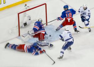 Tyler Johnson closes in for his third goal of the game with Henrik Lundqvist out of position. The goal counted due to Johnson getting his stick on the puck after Nikita Kucherov's kick. AP Photo by Julia Jacobson/Getty Images