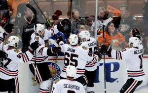 Marcus Kruger is congratulated by happy Hawks after winning the longest game in franchise history. Chicago evened the series with Anaheim prevailing 3-2 in triple overtime. AP Photo by Jae C. Hong/Getty Images