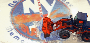 A truck removes the proud Islanders logo from the ice at Nassau Coliseum. Bruce Bennett/Getty Images 