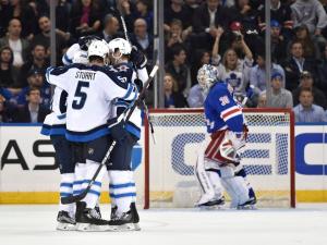 Little Scores: Jets forward Bryan Little scores one of his two goals in Winnipeg's 4-1 win over the Rangers. AP Photo/Kathy Kmonicek/Getty Images