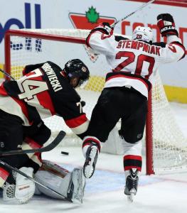 Lee Stempniak celebrates his game-tying goal with 32 seconds left in regulation. He also won the game in a shootout giving the Devils a 5-4 win over the Senators.  AP Photo by Fred Chartrand/The Canadian Press