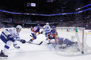 Following a big hit delivered on Thomas Hickey, Brian Boyle did in the Islanders by scoring the overtime winner in Game Three. The Lightning lead the second round series 2-1.   AP Photo by Bruce Bennett/Getty Images